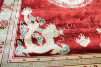 Lot 730 - MID 20TH CENTURY CHINESE FRINGED CARPET in...