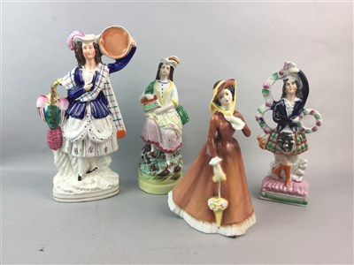 Lot 250 - A ROYAL DOULTON FIGURE OF 'JULIA' AND THREE STAFFORDSHIRE FIGURES