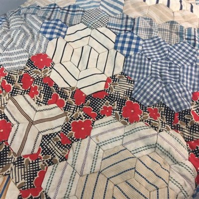 Lot 333 - A LATE VICTORIAN PATCHWORK QUILT