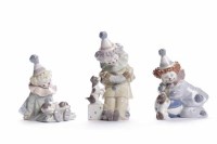 Lot 957 - THREE LLADRO FIGURES modelled as child clowns,...