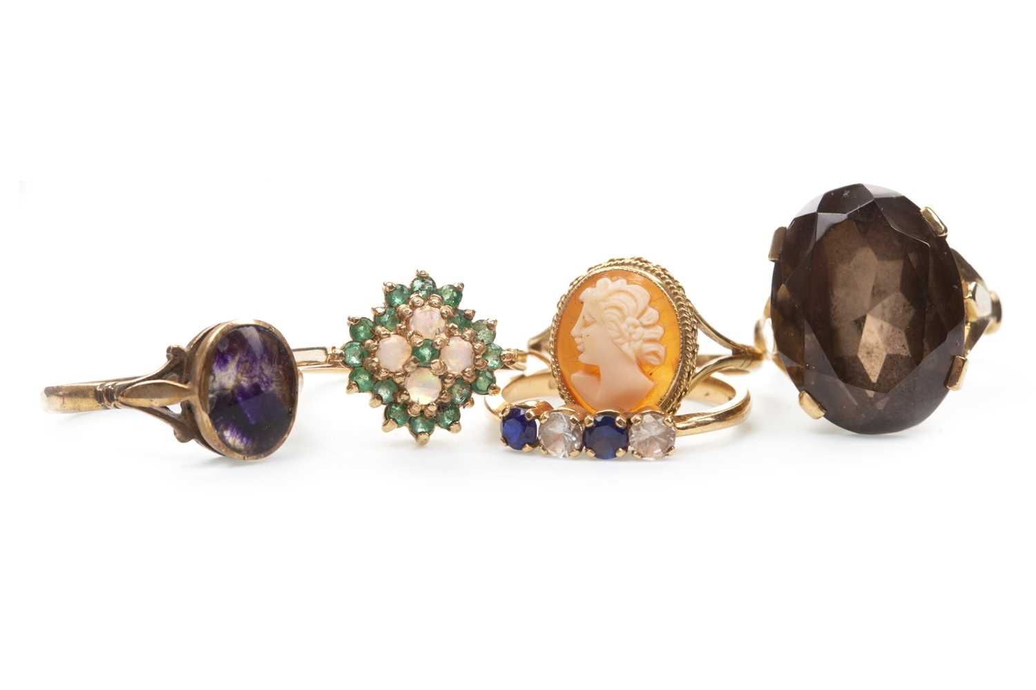Lot 132 - FOUR GEM SET RINGS AND A CAMEO RING