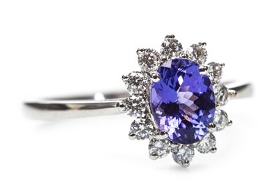 Lot 154 - A PURPLE GEM SET AND DIAMOND CLUSTER RING