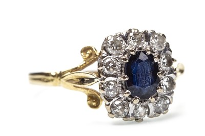 Lot 180 - A BLUE GEM AND DIAMOND CLUSTER RING
