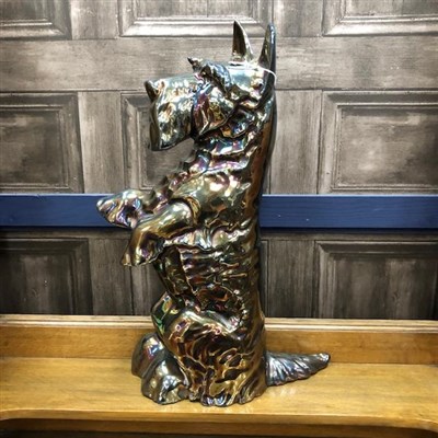 Lot 415 - AN EARLY 20TH CENTURY DOORSTOP/COMPANION STAND