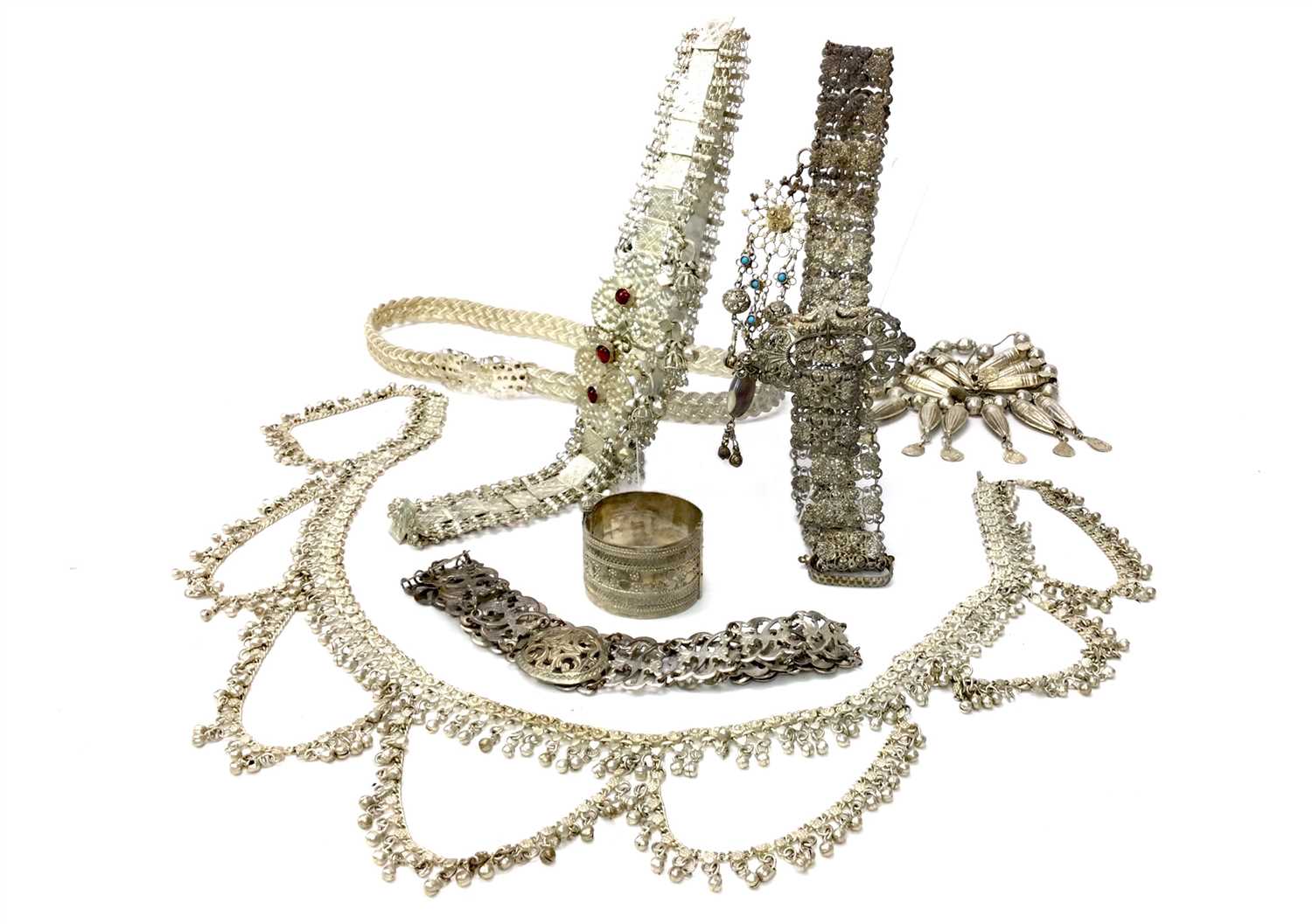 Lot 1056 - A COLLECTION OF EASTERN WHITE METAL BELTS AND CHAINS