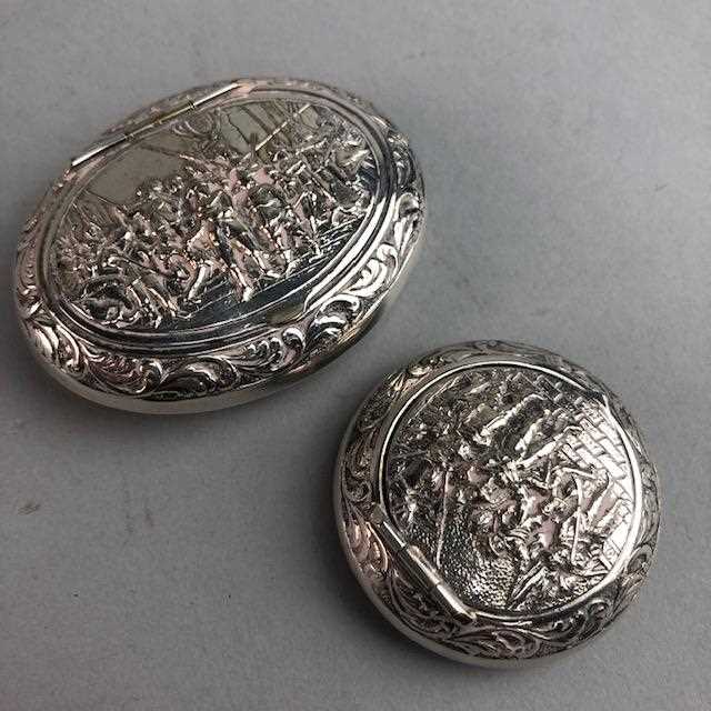 Lot 31 - TWO EMBOSSED WHITE METAL PILL BOXES