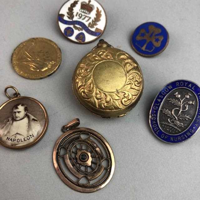 Lot 44 - A GROUP OF FOBS, BADGES AND A COIN HOLDER
