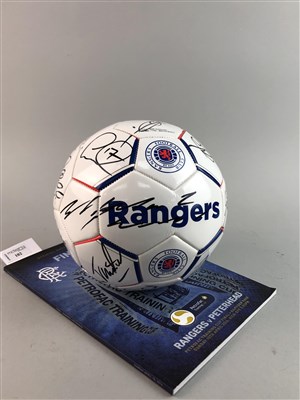 Lot 102 - A SIGNED RANGERS FOOTBALL AND A FOOTBALL PROGRAMME