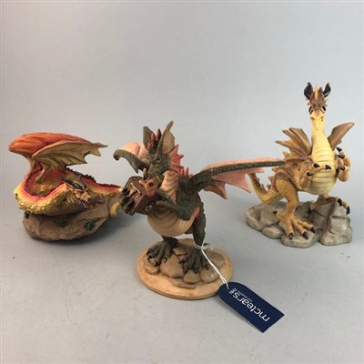 Lot 173 - A LARGE CERAMIC DRAGON AND EARTH GROUP AND SEVEN OTHER DRAGON FIGURES