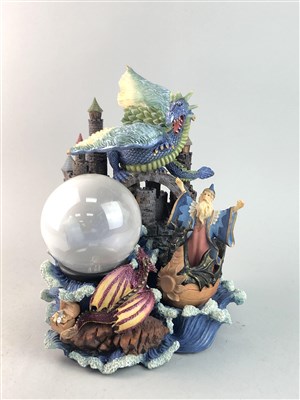 Lot 175 - A RESIN GROUP OF WIZARD, CASTLE AND A DRAGON AND TWO OTHERS