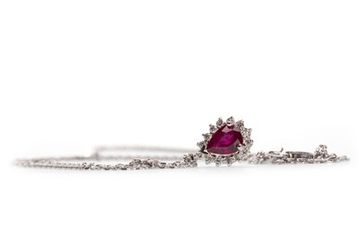 Lot 168 - A RUBY AND DIAMOND CLUSTER PENDANT