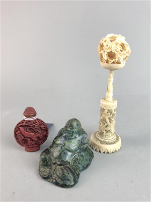 Lot 100 - A CHINESE CINEBAR BOX, PUZZLE BALL ON STAND, SNUFF BOTTLE AND A FIGURE OF BUDDHA