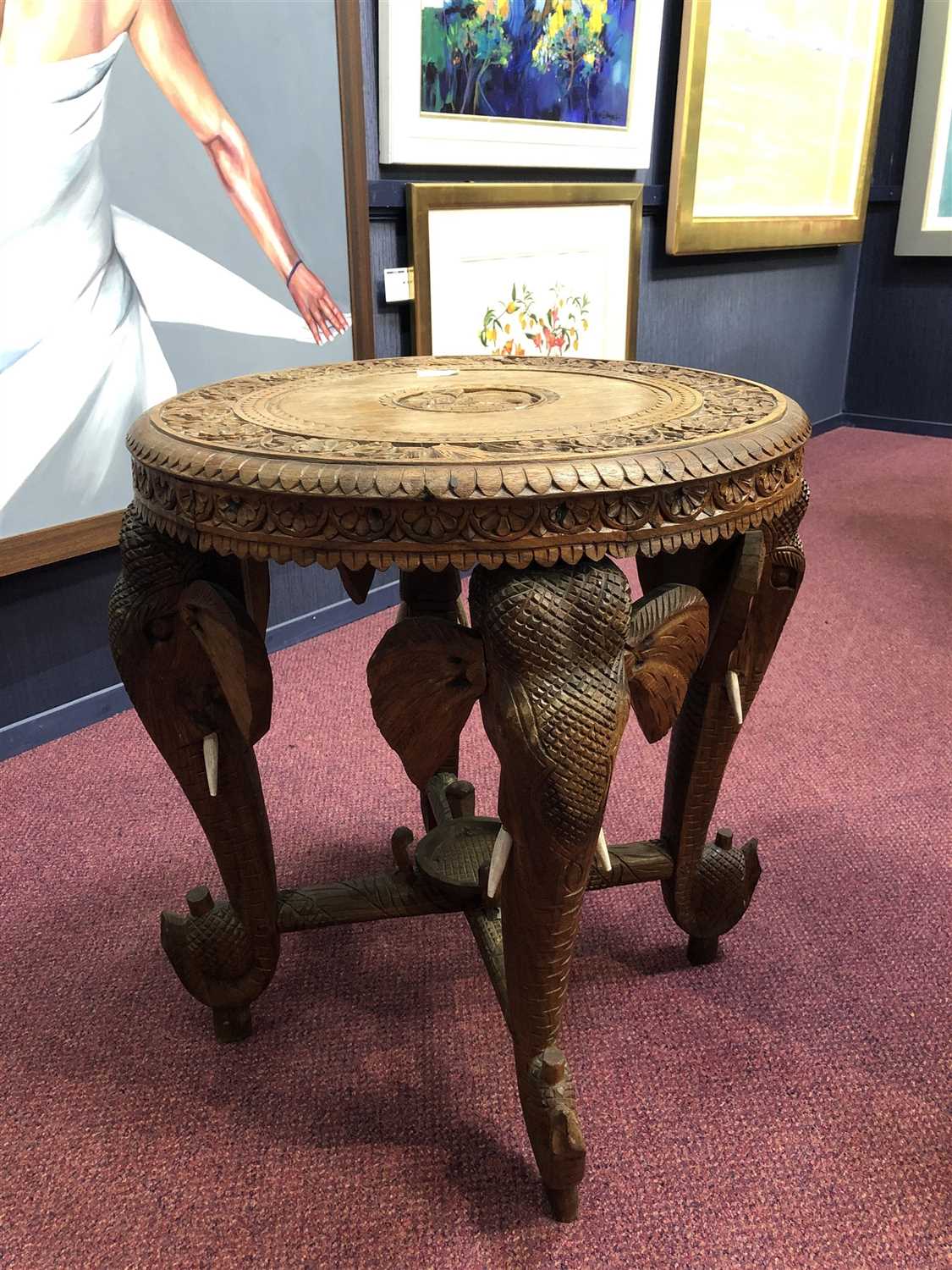 Lot 1004 - A MID-20TH CENTURY INDIAN CARVED ELEPHANT OCCASIONAL TABLE