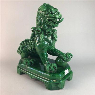 Lot 201 - A GREEN GLAZED CHINESE LION