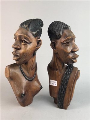 Lot 393 - A PAIR OF CARVED AFRICAN BUSTS