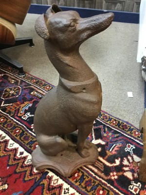 Lot 1554 - A VICTORIAN CAST METAL FIGURE OF A SEATED WHIPPET