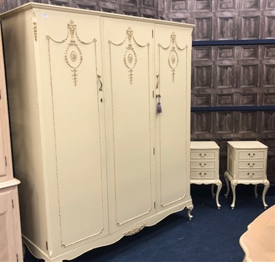 Lot 421 - A CREAM PAINTED THREE DOOR WARDROBE AND MATCHING BEDSIDE CABINETS