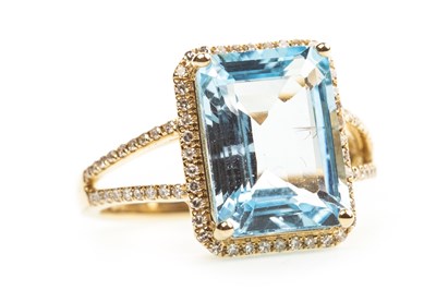 Lot 143 - A BLUE TOPAZ AND DIAMOND RING