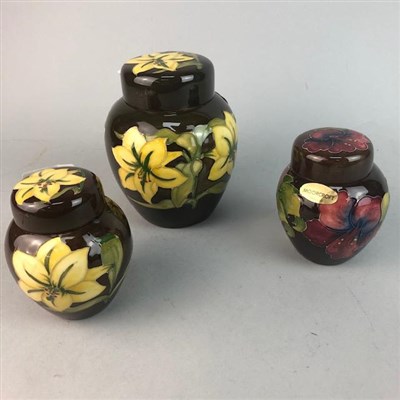 Lot 426 - THREE MODERN MOORCROFT GINGER JARS WITH COVERS