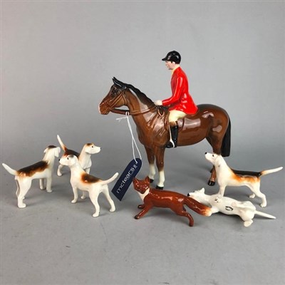 Lot 451 - A BESWICK FOXHUNTER FIGURE AND SIX FOX HOUND FIGURES