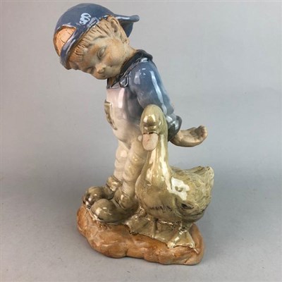 Lot 481 - A LARGE CERAMIC FIGURE OF A BOY AND SWAN AND A CERAMIC PLANTER