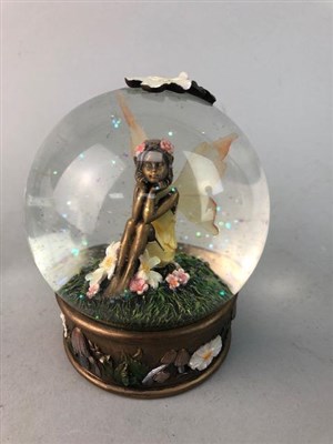 Lot 474 - A 'FAIRY AMBER WATERBALL' SNOW GLOBE, A MONEY BANK AND TWO FIGURES