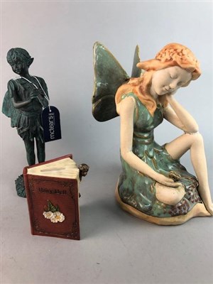 Lot 474 - A 'FAIRY AMBER WATERBALL' SNOW GLOBE, A MONEY BANK AND TWO FIGURES