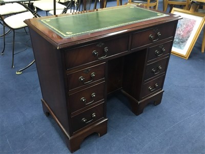 Lot 509 - A REPRODUCTION MAHOGANY KNEE HOLE WRITING DESK