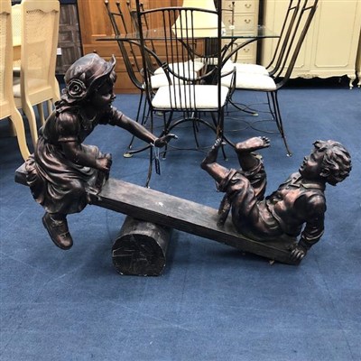 Lot 507 - A GARDEN FIGURE MODELLED AS CHILDREN ON A SEESAW