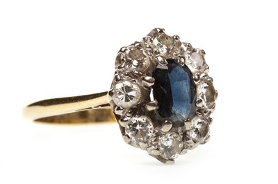 Lot 205 - A BLUE GEM SET AND DIAMOND CLUSTER RING