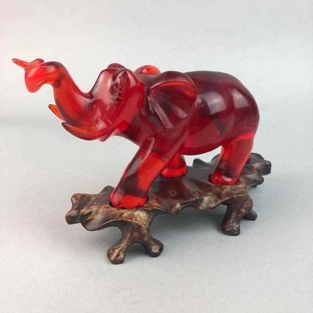 Lot 41 - A CHINESE RED BAKELITE MODEL OF AN ELEPHANT