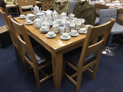 Lot 266 - AN OAK DINING TABLE AND SIX CHAIRS