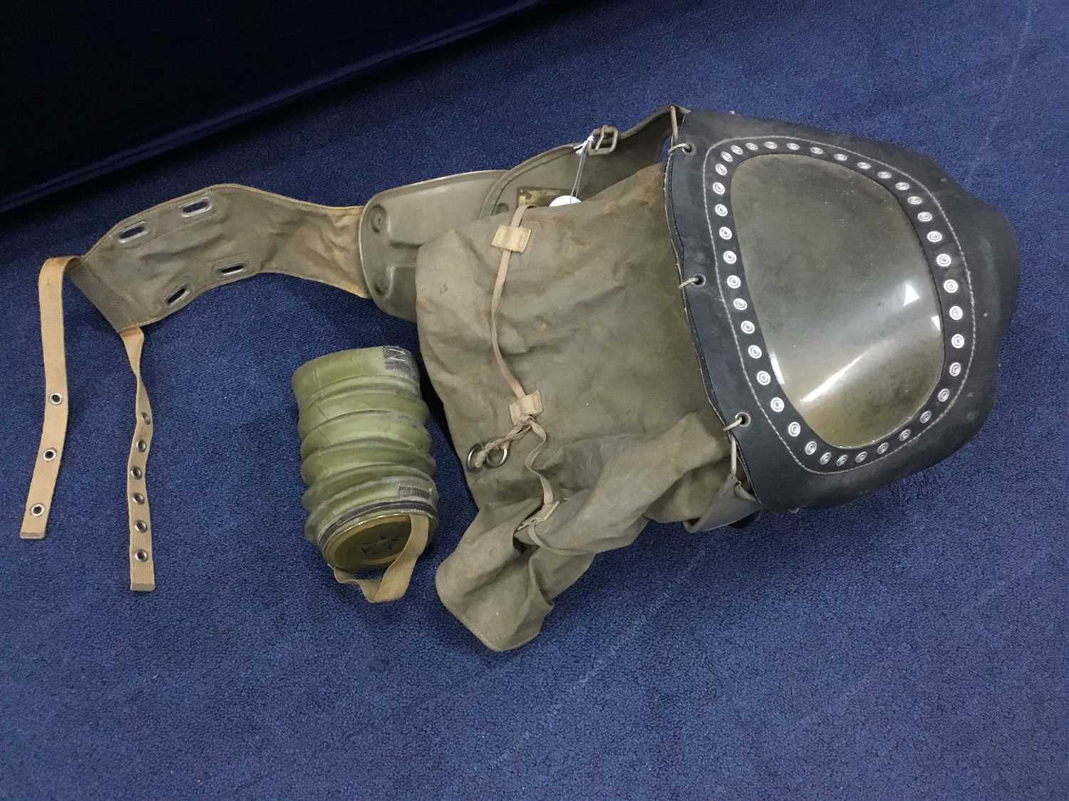 Lot 57 - A WWII BABY'S GAS MASK