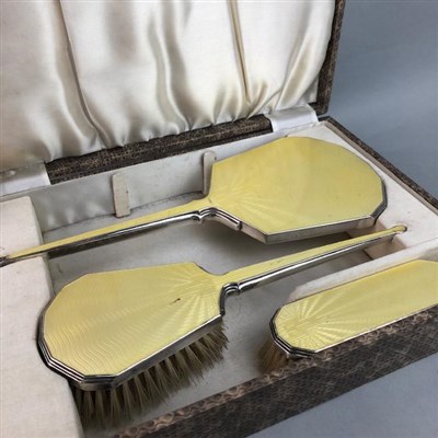 Lot 75 - A CASED WHITE METAL AND GUILLOCHE ENAMEL DRESSING TABLE SET AND A GROOMING KIT