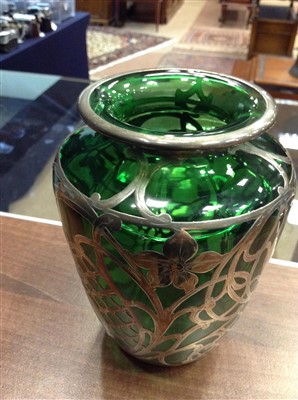 Lot 1261 - AN ART NOUVEAU SILVER OVERLAID GREEN GLASS VASE