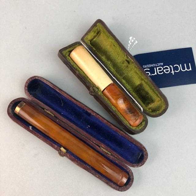 Lot 322 - TWO CIGARETTE HOLDERS