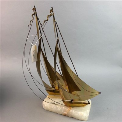 Lot 188 - A BRASS MODEL OF SAILING BOATS