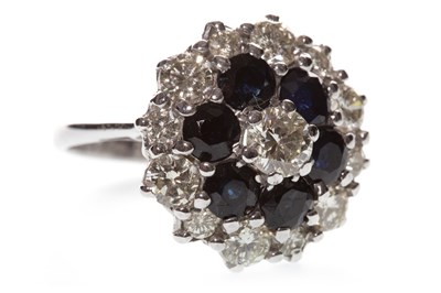 Lot 34 - A BLUE GEM AND DIAMOND CLUSTER RING