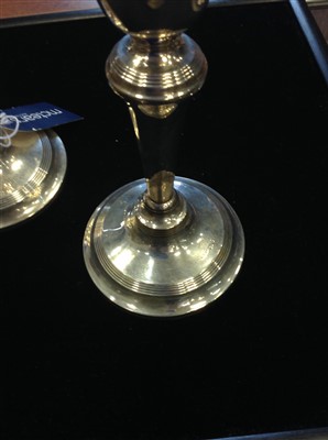 Lot 874 - A PAIR OF GEORGE V SILVER CANDLESTICKS