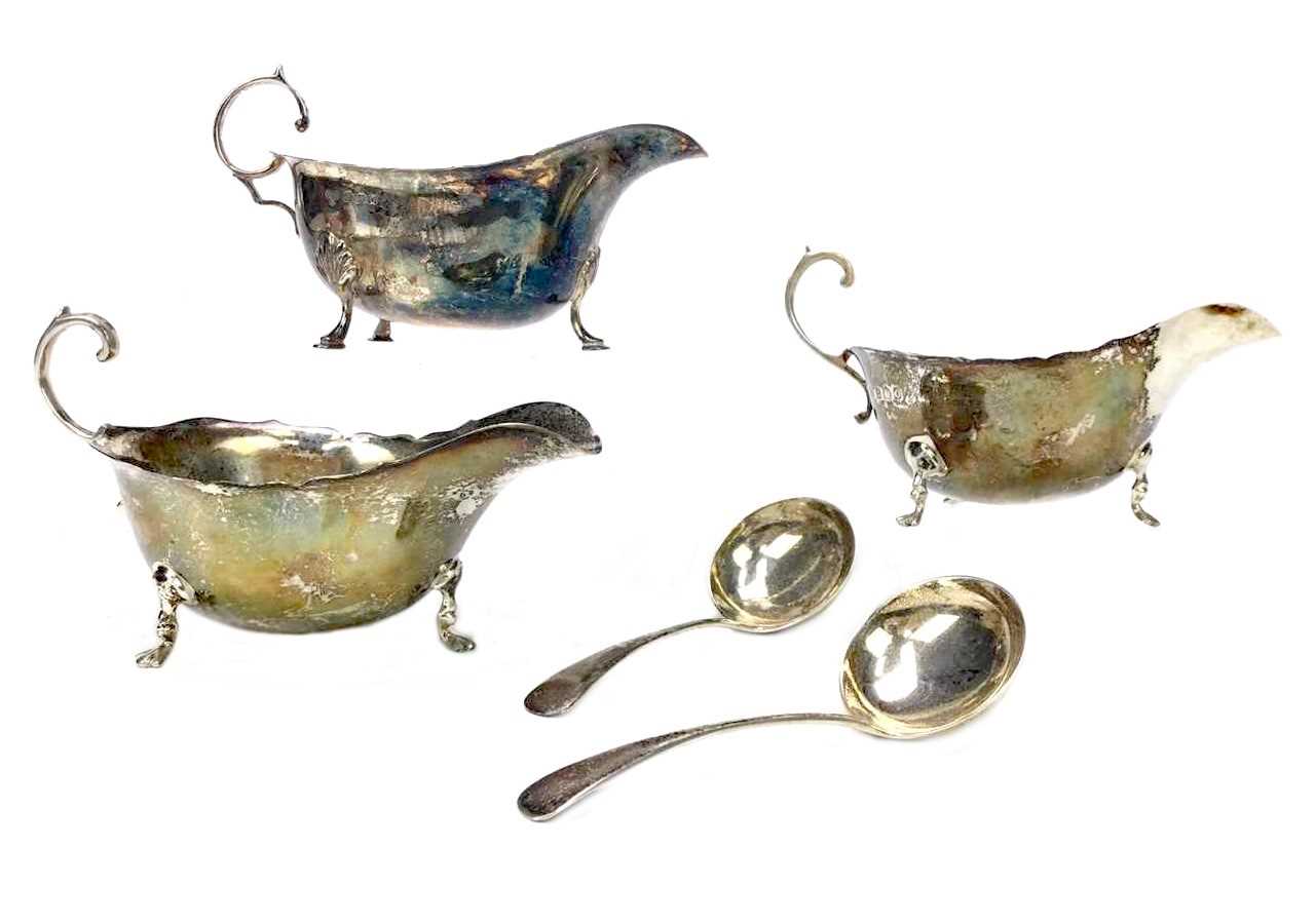 Lot 880 - A LOT OF THREE SILVER SAUCE BOATS AND TWO SAUCE LADLES