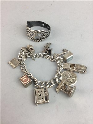 Lot 128A - A SILVER CHARM BRACELET AND A SILVER NAPKIN RING