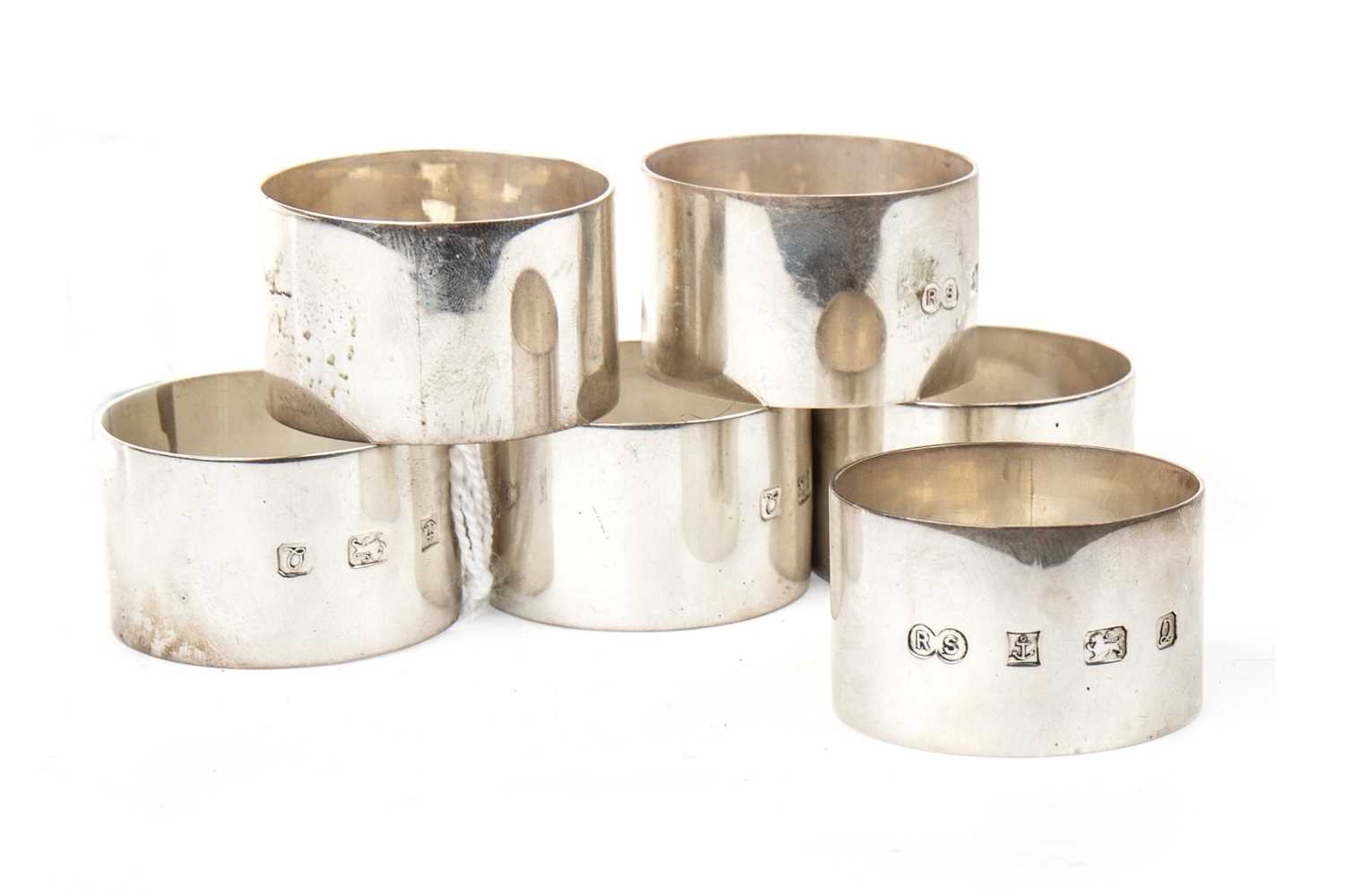 Lot 906 - A SET OF SIX SILVER NAPKIN RINGS