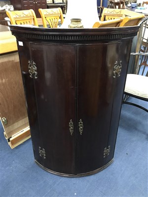 Lot 59 - A MAHOGANY BOW FRONTED CORNER CABINET