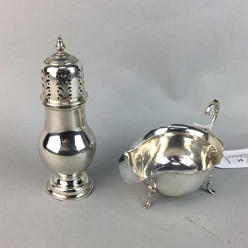 Lot 19 - A SILVER SUGAR CASTER AND SILVER SAUCE BOAT