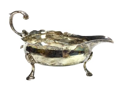 Lot 919 - A GEORGE III SILVER SAUCE BOAT