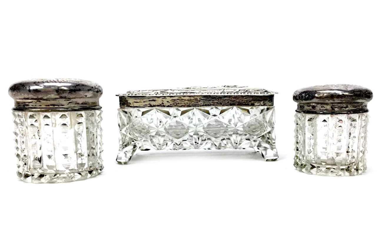 Lot 914 - A LOT OF THREE SILVER TOPPED DRESSING TABLE JARS