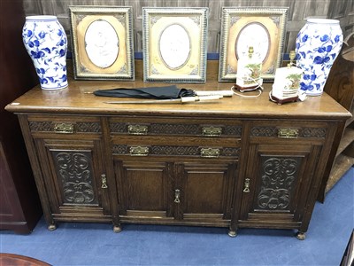 Lot 204 - A 20TH CENTURY CARVED OAK SIDEBOARD