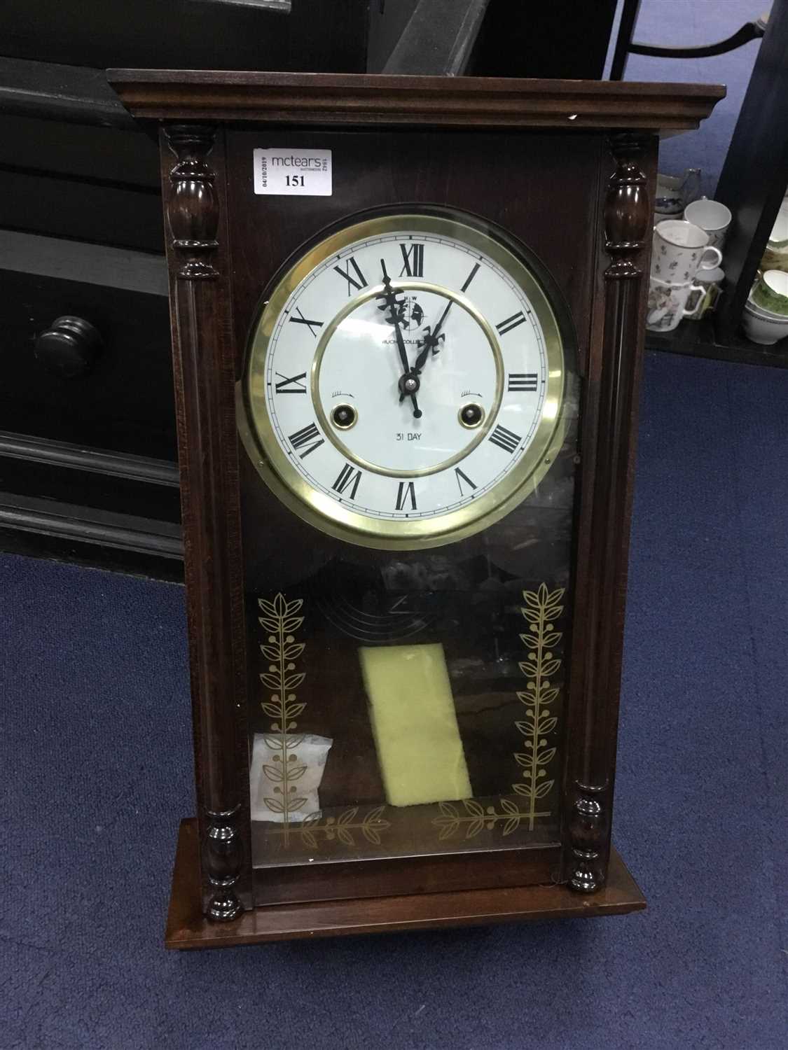 Lot 151 - A STAINED WOOD WALL CLOCK