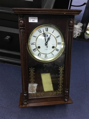 Lot 151 - A STAINED WOOD WALL CLOCK
