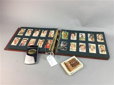 Lot 153 - A LOT OF CIGARETTE CARDS, SILVER TONGS, PLATED ITEMS AND AN ANNUAL